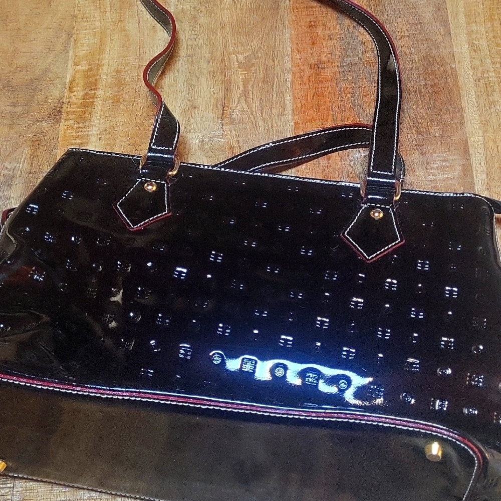 Black patent leather Arcadia purse.